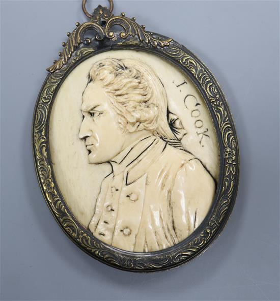 A 19th century carved ivory oval portrait plaque, signed J. Cook